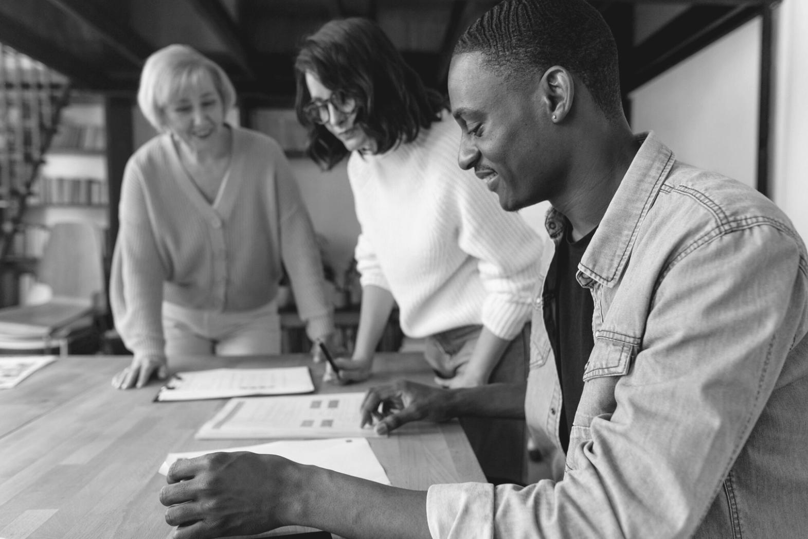 Strategic planning session with market research materials