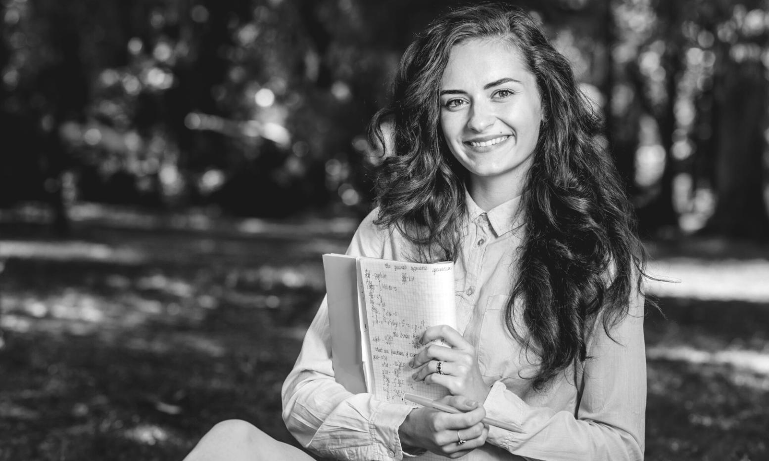 Students collaborating on online business strategies during program session